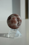 A pink amethyst mini crystal sphere with druzys and shimmer