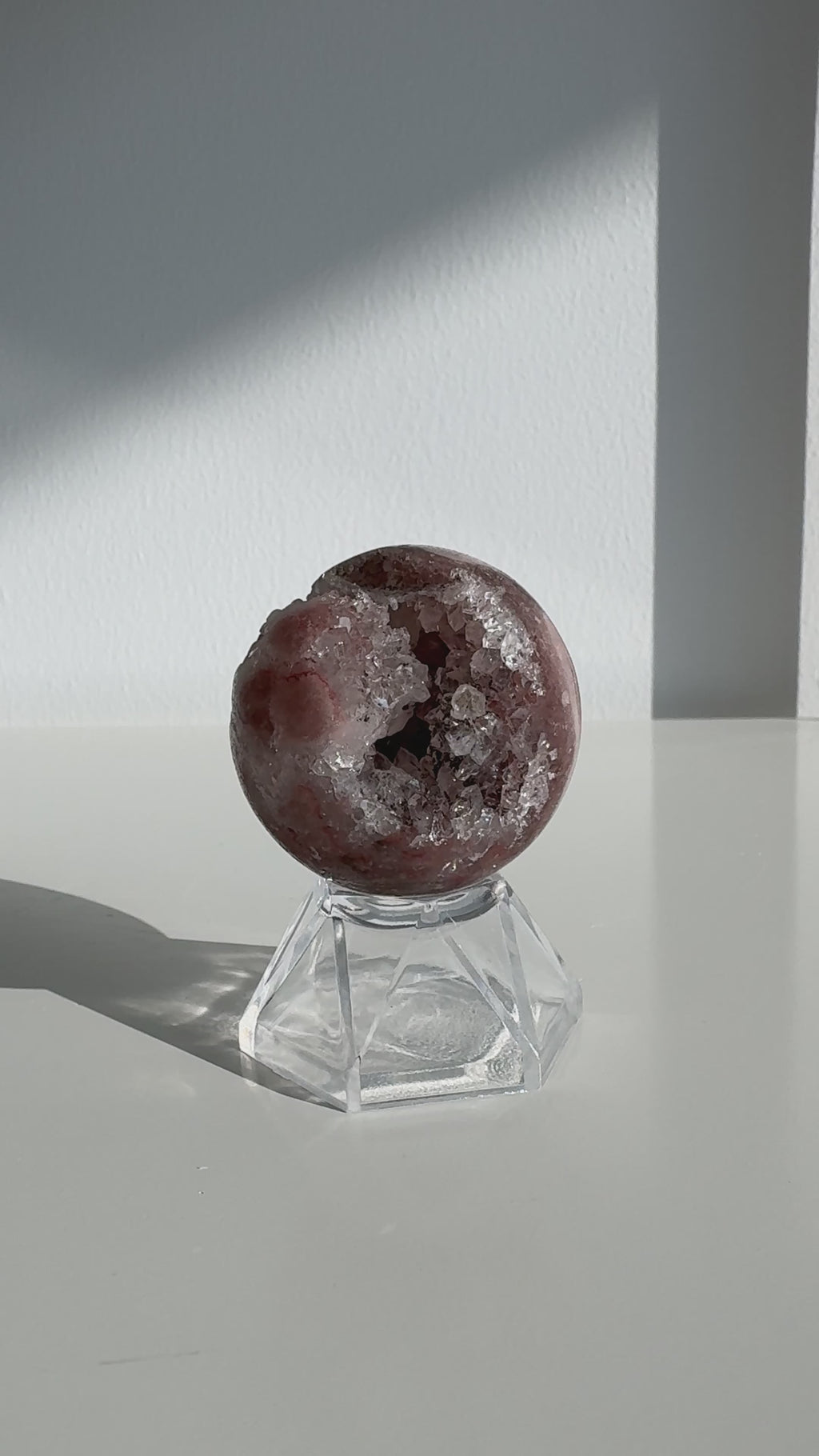 Video of a mini amethyst sphere with deep pink colouring 