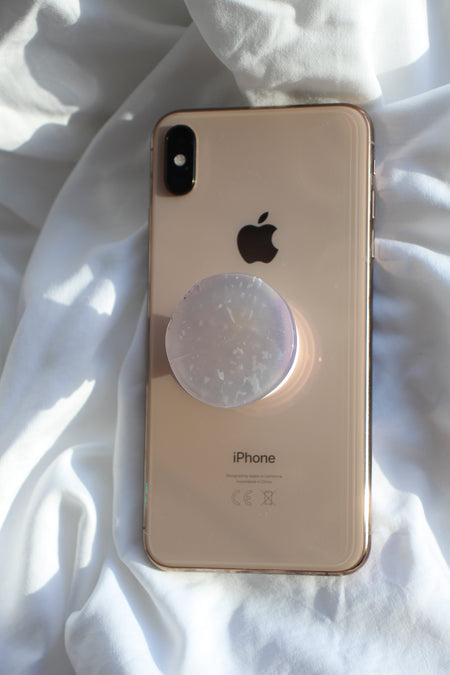 Grey Agate Crystal Phone Grip on the back of a rose gold iPhone on a white background