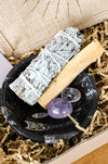 Cleansing Kit from 23 Urban, containing White Sage, Palo Santo, Clear Quartz, Amethyst and a Black Marble Fossil Bowl. 
