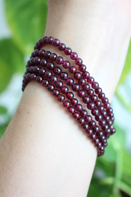 A stack of 5 beautiful deep red garnet bracelets with a delicate small bead size. Dubai Crystals. 23 Urban. 