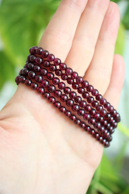 A stack of 5 beautiful deep red garnet bracelets with a delicate small bead size. Dubai Crystals. 23 Urban.