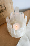 Beautiful Selenite Icicle Tealight Holder with a lit candle inside, showing it's wintery beauty. Dubai Crystals. 23 Urban.