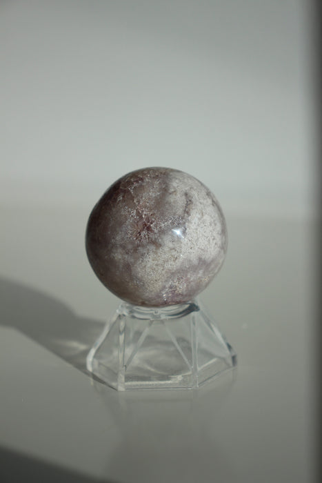 Shimmering purple and white mini amethyst sphere with sparkling crystal points