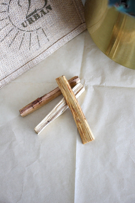 Three Palo Santo sticks, sustainably sourced from Peru