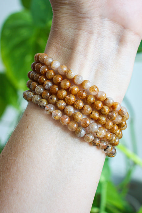 A stack of five Golden Rutile Bracelets. Dubai Crystals. 23 Urban.