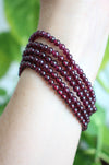 A stack of 5 beautiful deep red garnet bracelets with a delicate small bead size. Dubai Crystals. 23 Urban. 